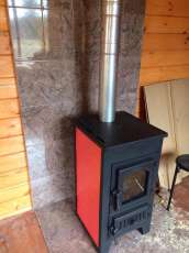 Купить стальной камин Везувий ПК-01 (270) в Молодечно фото в интерьере в Молодечно