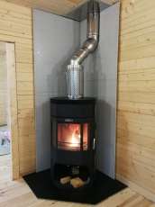 Недорогой камин с отделкой шамотом Сибирь 12 фото в интерьере в Молодечно