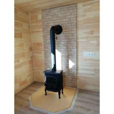 Чугунный камин со стеклом Сибирь 7 фото в интерьере в Молодечно