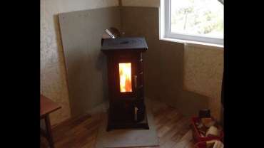 Отопительная печь Термофор Статика Тетра, чёрная бронза фото в интерьере в Молодечно