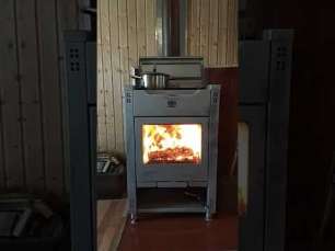 Стальной камин со стеклом Теплодар Кадриль фото в интерьере в Молодечно