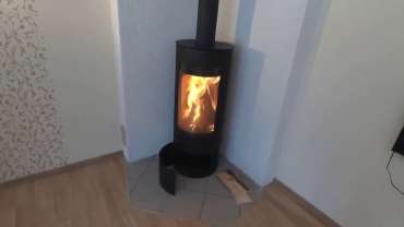 Стильная печь-камин с шамотом Мета-Бел Селигер в Молодечно фото в интерьере в Молодечно