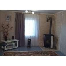 Стальной камин с шамотом Мета-Бел Ритм L фото в интерьере в Молодечно