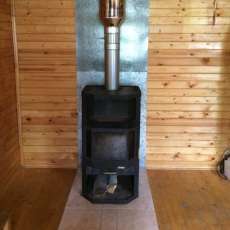 Печь-камин с шамотом Мета-Бел Ангара-Аква в интерьере фото в Молодечно