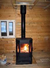 Печь-камин Бавария водяной с плитой в интерьере в Молодечно