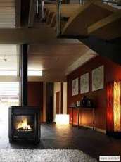 Печь-камин чугунный Invicta Carolo в интерьере Амазонка бай фото  в Молодечно