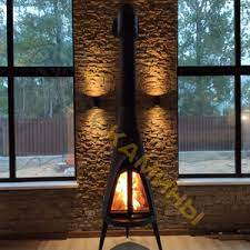 Печь-камин чугунный Invicta Pow-Wow в интерьере Амазонка бай фото в Молодечно